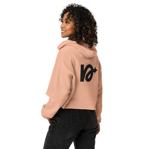 Model wearing NVR5TOP crop hoodie in urban setting – bold, island-inspired fashion