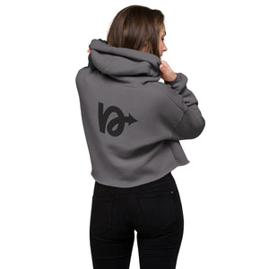Model wearing NVR5TOP crop hoodie in urban setting – bold, island-inspired fashion